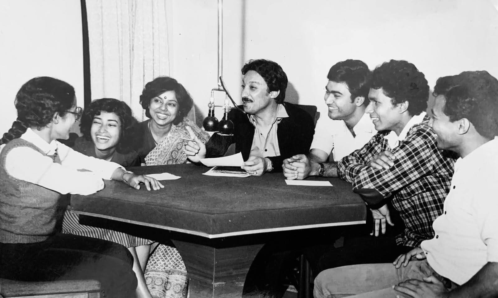 That is me sitting next to Ravindra Jind - the guy in the dark jacket (a TV newsreader who was conducting this radio show for All India Radio). To my left is my friend from school Arvind Singhal (read about him here)